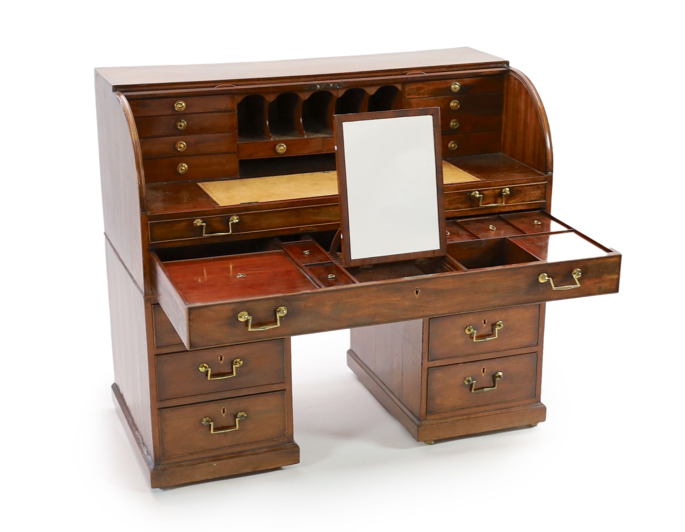 A George III mahogany cylinder top combined writing and dressing kneehole desk, W.122cm D.61cm H.110cm